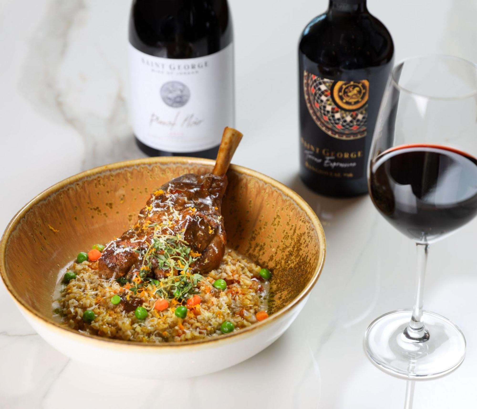 Crowne Plaza Jordan Dead Sea Resort & Spa By Ihg Sweimeh Esterno foto A lamb leg confit served with a glass of red wine